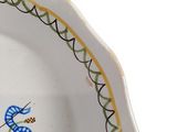a white plate with a blue and yellow design on it