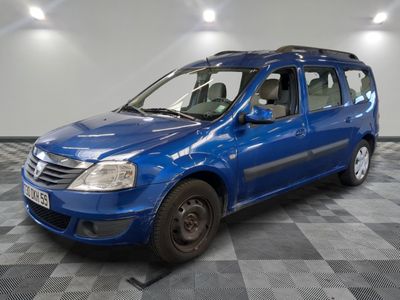 the small blue van is parked in a room with a checkered floor