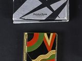 two lighters and a box of matches on a table