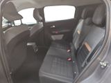 the back seats of a car are empty and the passenger seat is empty