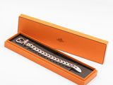 a close up of a watch in a box on a white surface