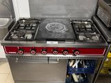a kitchen with a stove, oven, microwave, and dishwasher in it