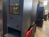 a red hand truck that is parked in a building