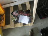 a person standing next to a pallet with a lot of things on it