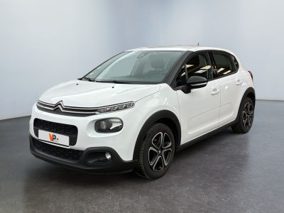 a white citrole car parked in a white room