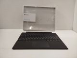 a laptop computer sitting on top of a white table