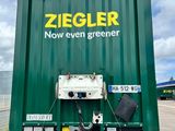 a green container with a sign on it that says ziegler now even greener