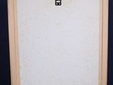 an easel with a painting on it and a black background