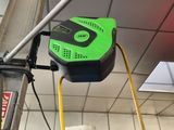 an image of a parking meter with a green sign on it