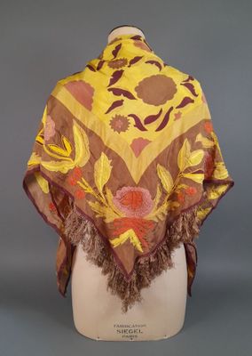 an image of a yellow and brown shawl with flowers on it