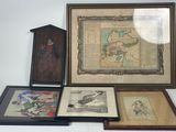four framed pictures of birds and a birdhouse on a table