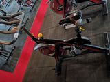 a gym with a row of stationary bikes in it