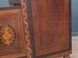 a small cabinet with a drawer on it in a room