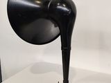 a black lamp that is sitting on a white table