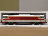 a toy train sitting in a box on a table