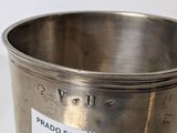 a silver cup with a price tag on it