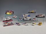 a lot of toy cars that are in a display case