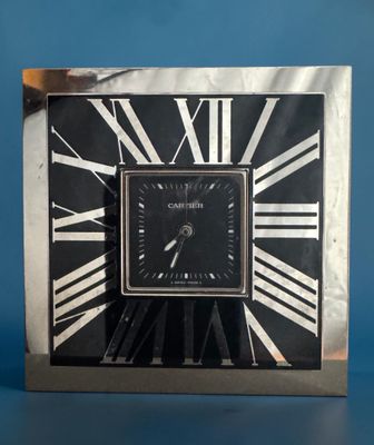 an image of a clock with roman numerals on a blue background