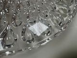 a close up of a glass bowl with water droplets on it