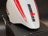 the helmet is sitting on top of a box on a black surface
