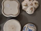a lot of small plates and bowls on the table