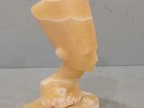 statue of a woman ' s head made of soap on a marble base