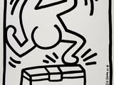 a black and white drawing of a dog jumping out of a box