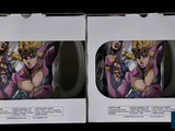 two mugs that are in a box on the table