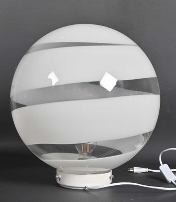 a light that is sitting on a table next to a charger