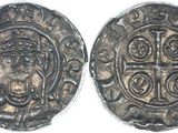 a silver coin with a cross on the front and a cross on the back