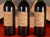 three bottles of wine sitting next to each other on a table
