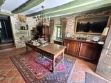 a living room with a table and a rug on the floor