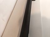 an image of a close up of a metal rod on a white surface