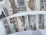 a lot of old postcards that are on a table