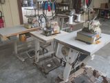 two sewing machines that are sitting on a table