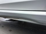 a close up of a car ' s rear bumper