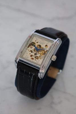 a watch that is sitting on a marble surface