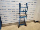 the blue ladder is next to a wall with a sign on it