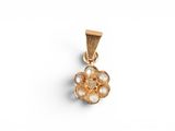 a close up of a gold pendant with pearls on a white background