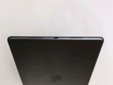 the back of a laptop computer sitting on top of a white surface