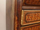 a wooden chest of drawers with a mirror on top of it