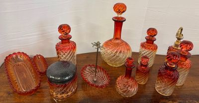 a lot of glass bottles on a wooden table