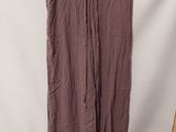 a brown skirt hanging on a hanger in front of a white backdrop