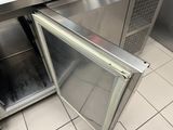 an open refrigerator in the middle of a kitchen