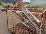 a cage with a bunch of baseball bats in it