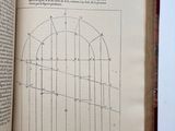 an open book with a drawing of a gate