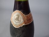 a bottle of wine that is sitting on a table