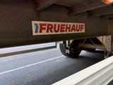 a truck that has a sign on the side of it