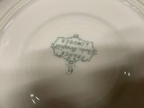 a close up of a white plate with writing on it