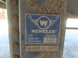 a close up of a sign on a metal pole